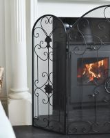 Close up of ornate detailing on triple fold fire screen
