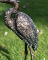 Close up of sculpture"s wings and feather details
