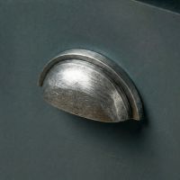 An Aged Pewter Concealed Drawer Pull Mounted on a Contemporary Blue Kitchen Drawer - Digital Illustration
