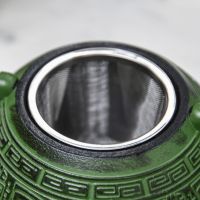 Close-Up of Tea Infuser on Japanese Inspired Ancient Oriental "Ahuic" Green Cast Iron Teapot 