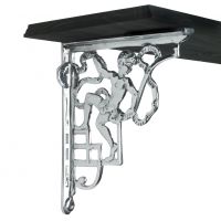 Bright chrome cherub wall bracket supporting black shelf Bright chrome cherub wall bracket supporting black shelf