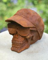 angled view of cast iron skull garden ornament