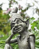 Close up of face detail on pixie garden statue