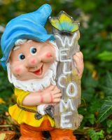 Close up of intricate detail on colourful outdoor gnome ornament