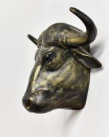 Side view of animal head wall bust