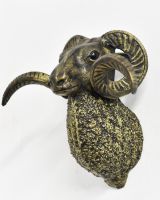 Angled view of black and gold animal wall bust