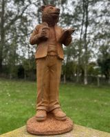 Angled view of rustic finish bear outdoor statue