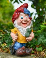 Angled view of colourful gardening gnome statue