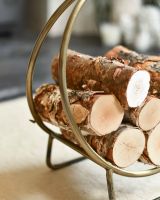 Close-Up of 45cm Antique Brass Contemporary Circular Log Rack & Holder With Handle in Situ