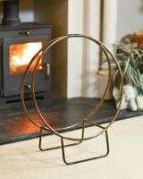 Antique Brass Contemporary Circular Log Rack & Holder With Handle In A Fireplace Setting Antique Brass Contemporary Circular Log Rack & Holder With Handle In A Fireplace Setting