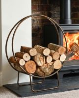 Antique Brass Contemporary Circular Log Rack & Holder With Handle In Situ Digital illustration