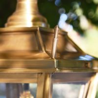 Close-up of the Finials on the Lid of the Antique Brass Dorchester Chain Hanging Porch Lantern