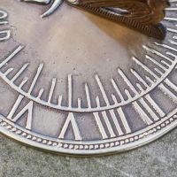 Close-Up of Roman Numeral Casting on Sundial