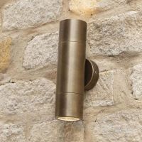 Antique Brass Spotlight Cylinder Wall Light in Situ on a Stone Wall Antique Brass Spotlight Cylinder Wall Light in Situ on a Stone Wall