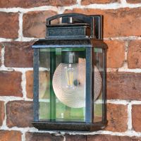 Antique Bronze Hanging Wall Light on a Brick Wall Antique Bronze Hanging Wall Light on a Brick Wall