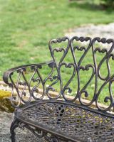 Close-Up of Antique Bronze Hawthorn Heart Rocking Bench 