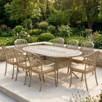 Antique Champagne "Marianne" Eight Seater Garden Table & Chair Set digital illustration in a lush garden Antique Champagne "Marianne" Eight Seater Garden Table & Chair Set digital illustration in a lush garden