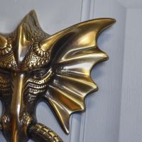 Close-Up of Antique Copper Dragon Head Door Knocker Close-Up of Antique Copper Dragon Head Door Knocker