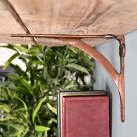 Side View of the Antique Copper Stylish Architectural Shelf Bracket Side View of the Antique Copper Stylish Architectural Shelf Bracket