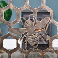 Close-up of the Antique Gold Bee on the Fireguard