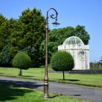 Antique Gold Deluxe Cast Iron Lamp Post Installed In Garden Setting Antique Gold Deluxe Cast Iron Lamp Post Installed In Garden Setting