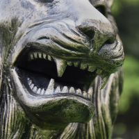 Close-up of the Face of the Antique Gold Lion Sculpture