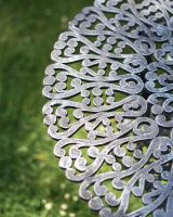 Close-Up of Table on Antique Silver "Ascott" Two Seater Bistro Set