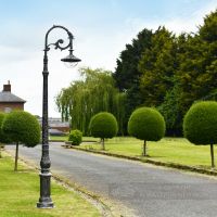 Antique Silver Cast Iron Lamp Post In Period Driveway Setting
