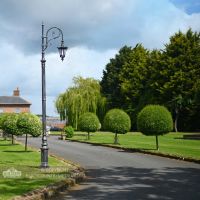 Antique Silver Ornate Cast Iron Swan Neck Lamp Post Installed On Driveway Antique Silver Ornate Cast Iron Swan Neck Lamp Post Installed On Driveway
