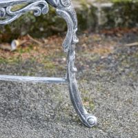 Close-Up of Integral Legs on Antique Silver Outdoor Bench