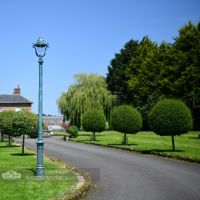 Antique Verdigris Green Cast Iron Lamp Post Installed Along Driveway