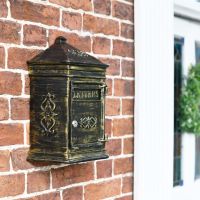 Side View of the Bantock Post Box in Antique Bronze Mounted on a Brick Wall