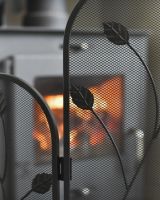 Close up of leaf detailing on fire screen Close up of leaf detailing on fire screen