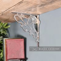 "Art Nouveau" Polished Aluminium Shelf Bracket Holding up a Wooden Shelf