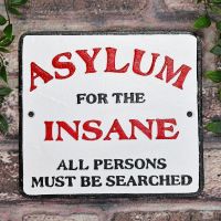 "Asylum For The Insane" Cast Iron Sign in Situ on Brick Wall "Asylum For The Insane" Cast Iron Sign in Situ on Brick Wall