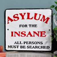 "Asylum For The Insane" Cast Iron Sign in Situ Next to a Blue Wall "Asylum For The Insane" Cast Iron Sign in Situ Next to a Blue Wall