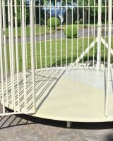 Close up of entrance and base of grand birdcage inspired gazebo Close up of entrance and base of grand birdcage inspired gazebo