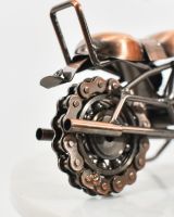 Close up of wheel on recycled scrap metal art sculpture Close up of wheel on recycled scrap metal art sculpture