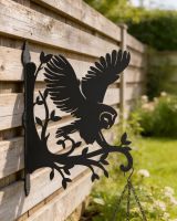 Barn Owl Hanging Basket Bracket mounted on a contemporary wooden fence Barn Owl Hanging Basket Bracket mounted on a contemporary wooden fence