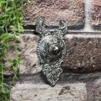 Bright Chrome Bell push on brick wall Bright Chrome Bell push on brick wall