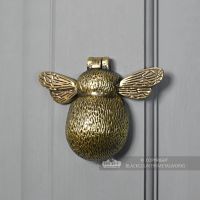 Bumblebee door knocker on grey door
