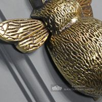 Detailed image of wing of bee door knocker