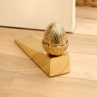 Polished brass Acorn door wedge Polished brass Acorn door wedge