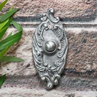 Satin Chrome Bell push on brick wall Satin Chrome Bell push on brick wall