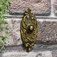 Antique Brass Door Buzzer on Brick wall
