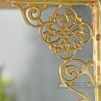 Detailed image of brass ornate shelf bracket Detailed image of brass ornate shelf bracket