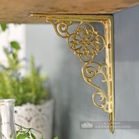 Interior design shelf bracket, polished brass finish Interior design shelf bracket, polished brass finish