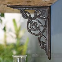 Compact floral bracket finished in cast iron Compact floral bracket finished in cast iron