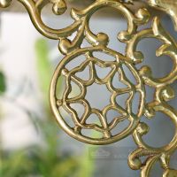 Close up of cast brass scroll detail Close up of cast brass scroll detail