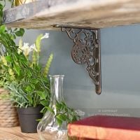Ornate natural iron kitchen shelf bracket Ornate natural iron kitchen shelf bracket